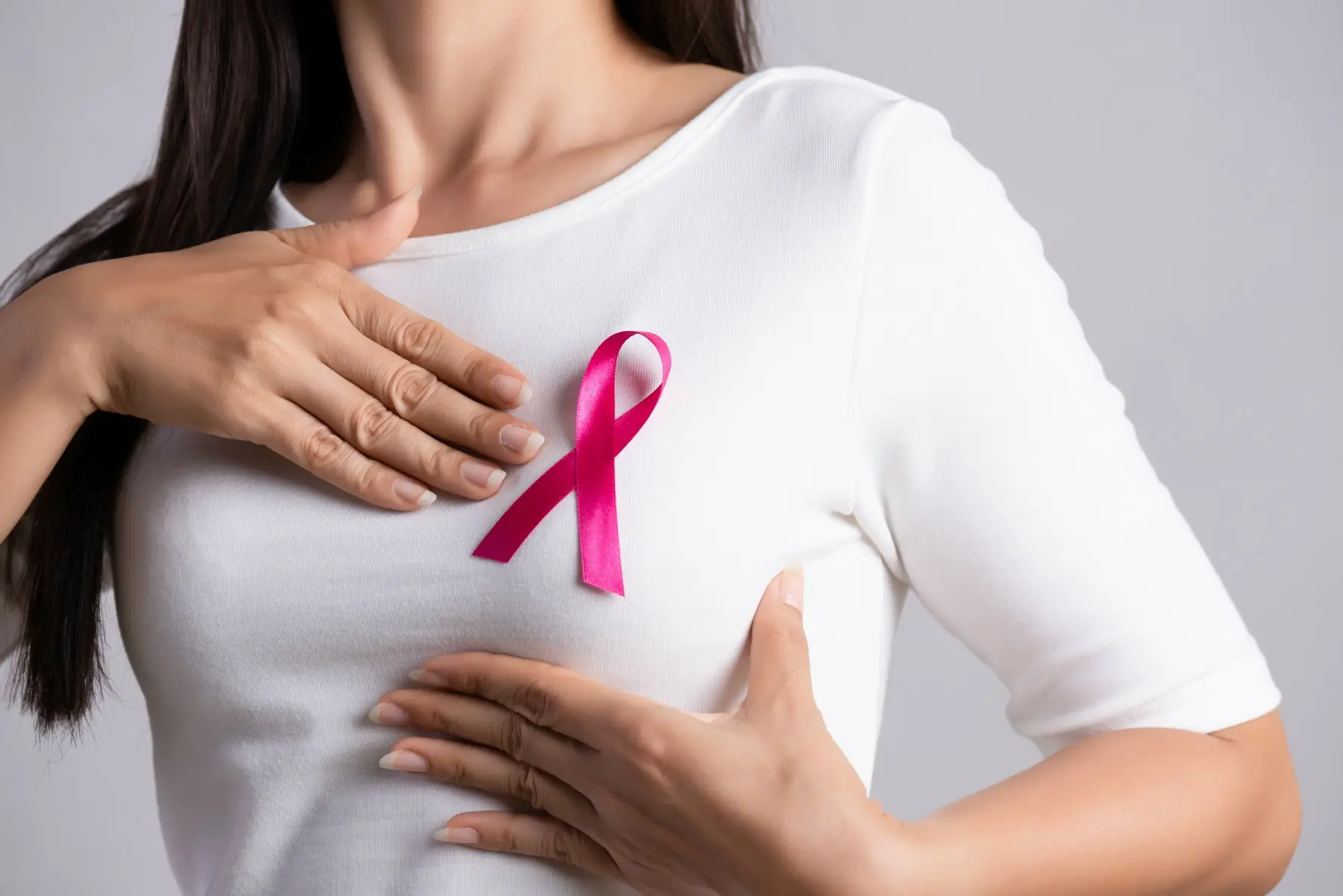 1920_stockphotoofapersonwearingabreastcancerribbon